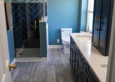 A bathroom remodel featuring tile and hardwood flooring